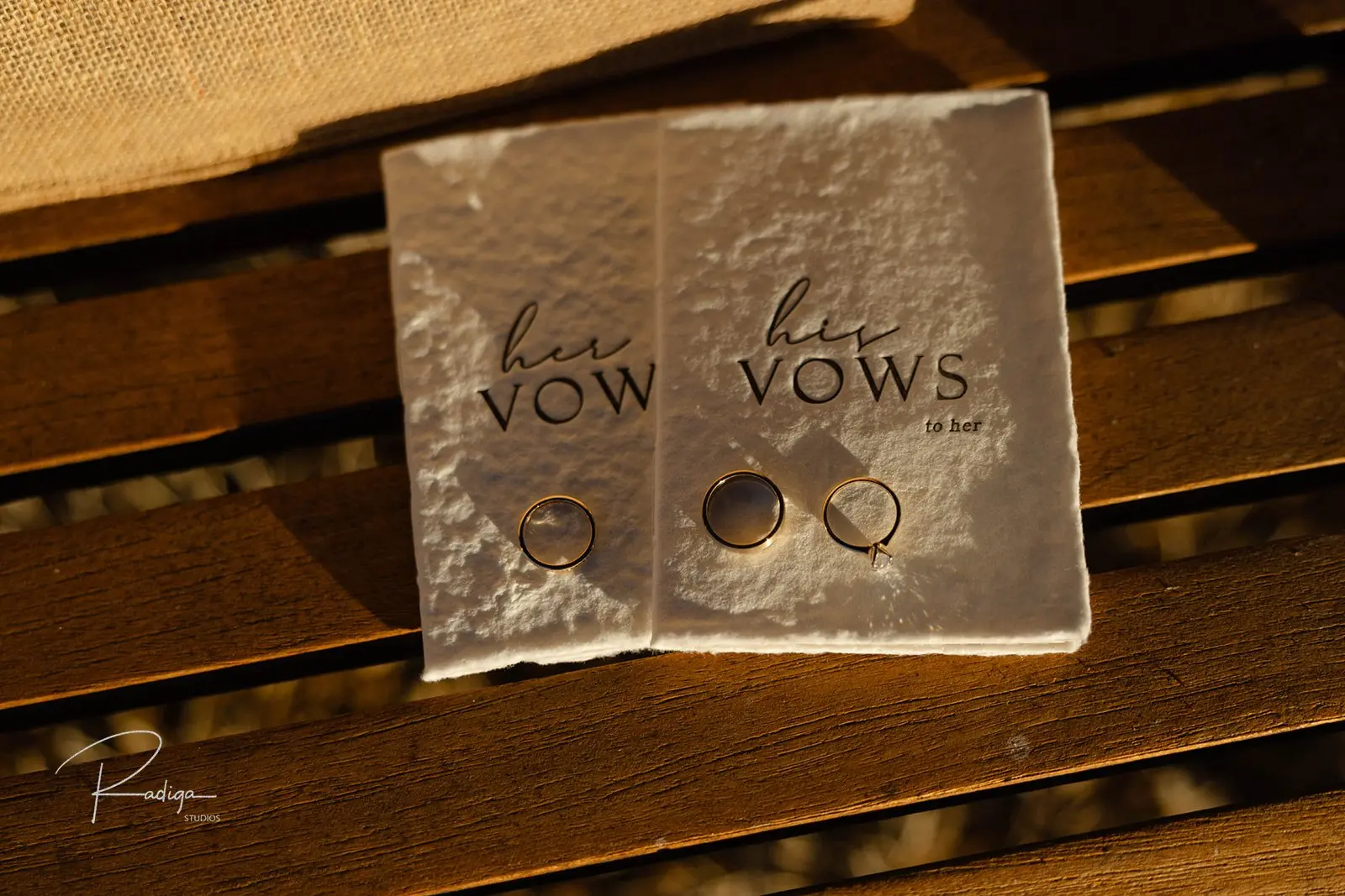 Her vows and his vows booklets with the wedding rings