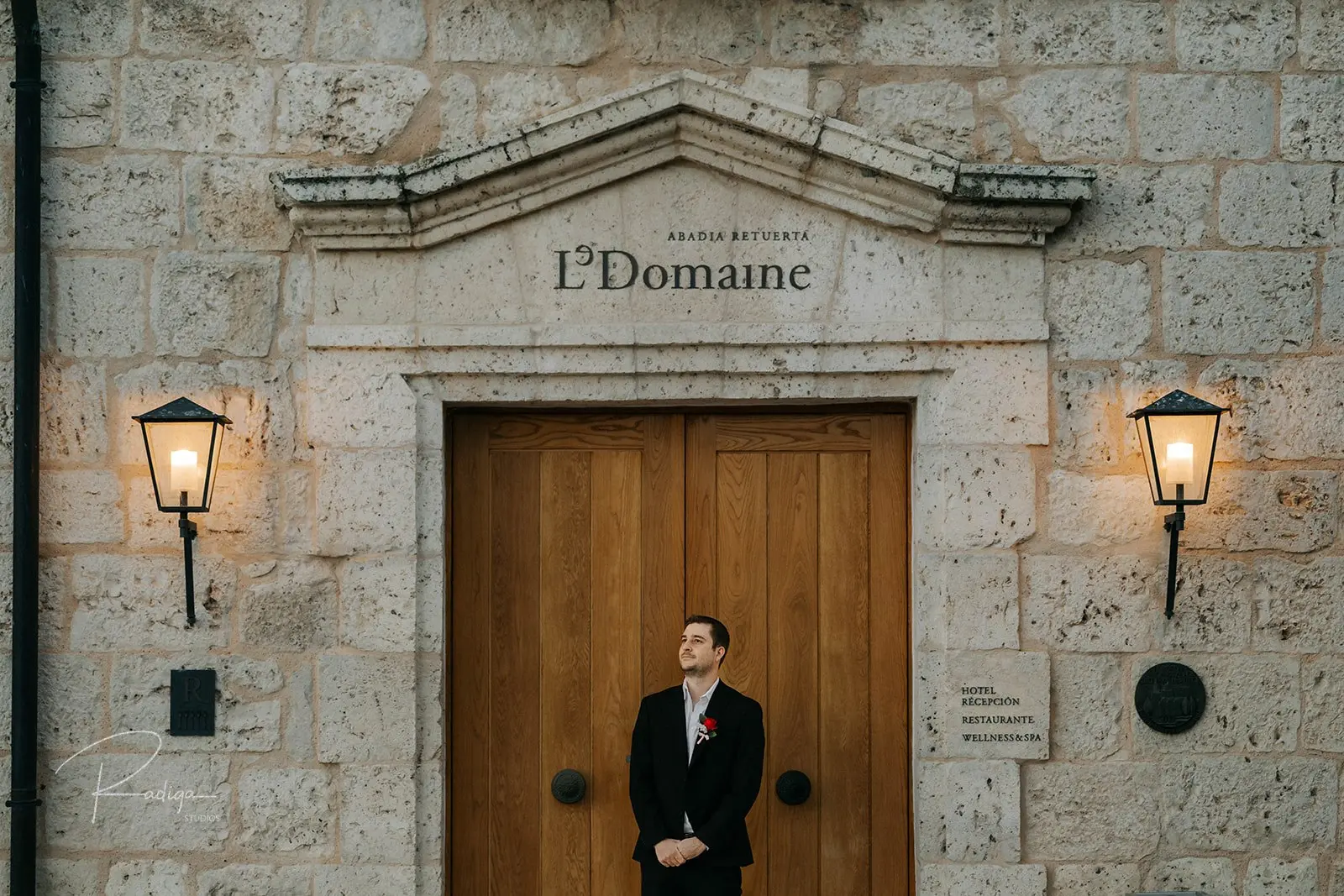 The groom waiting at the LeDomaine entrance of Abadía Retuerta