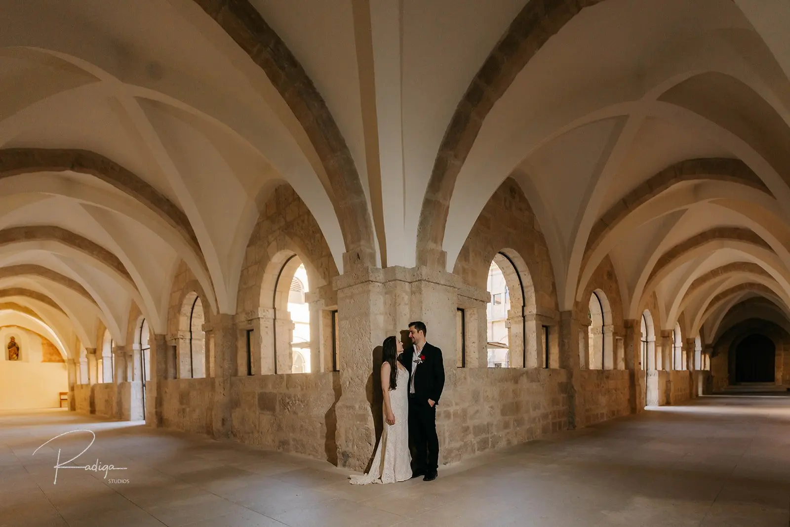 The couple beneath the Gothic vaults of the abbey