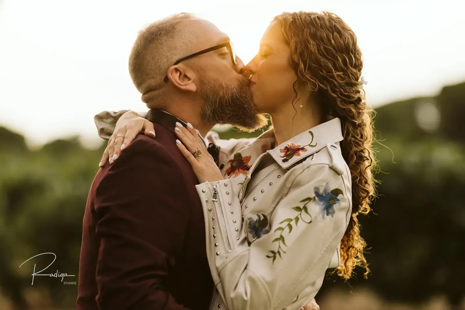 The couple kissing among the vineyards of Bodegas Arzuaga in Ribera del Duero, Spain